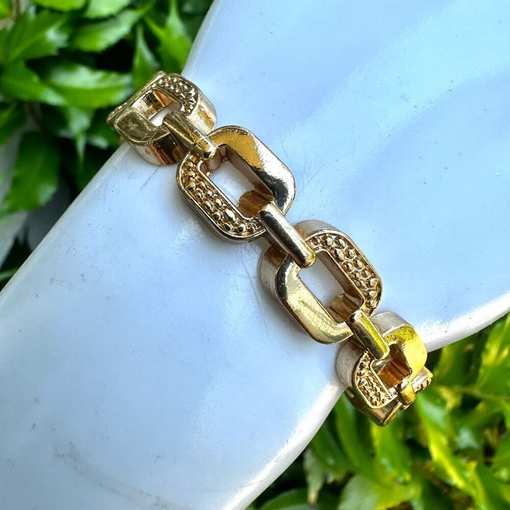 Gold tone link hinged bracelet